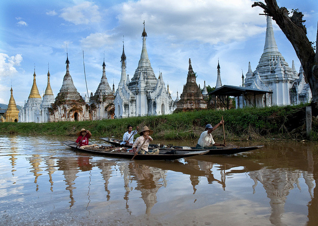 by c.ledur on Flickr.Boating on Inle Lake with buddhist stupas on the background, Myanmar.