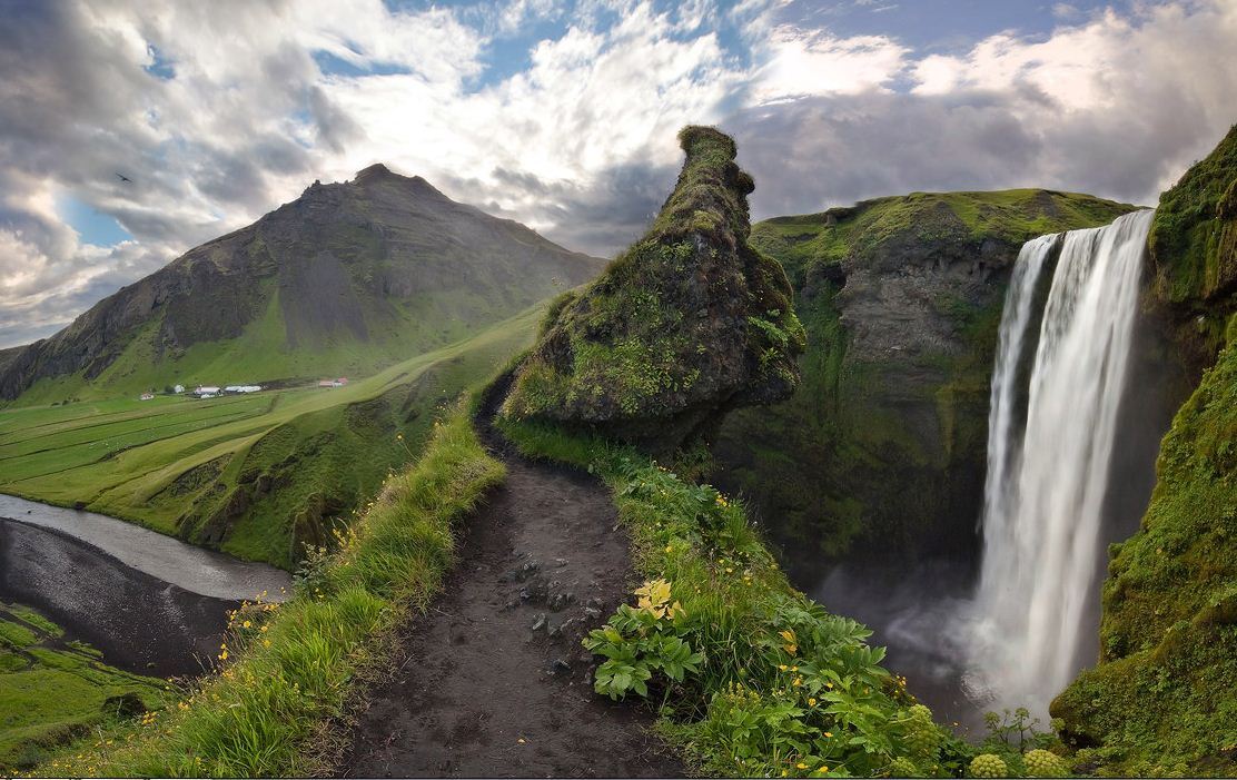 Giant guarding Skogafoss Waterfall, Iceland