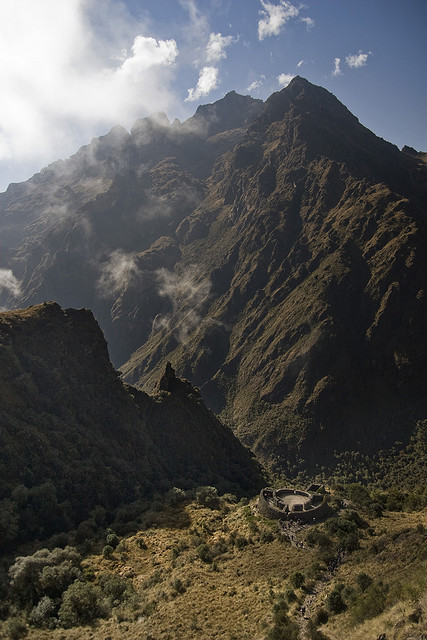 The ruins of Runkurakay sit on a hill between mountain ridges, The Inca Trail, Peru