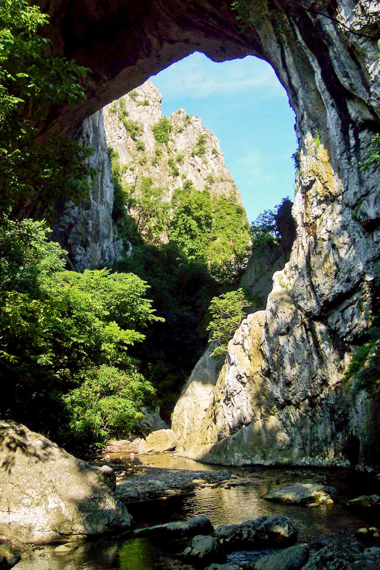 Natural arch in Vratna River Gorge in eastern Serbia.