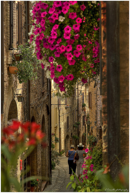 Strolling on the beautiful streets of Spello in Umbria, Italy
